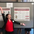 Elena Wang in front of her poster at the Stanford Optic Disc Drusen Conference 